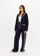 THE UPSIDE women's navy Monte Carlo Alix Knit Blazer fits true-to-size and features contrast white edge along collar and placket and patch pockets at front. Made for lifestyle.