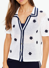 THE UPSIDE women's white organic cotton Piazza Koa Knit Shirt features a ribbed white collar with navy striped placket edge and pearlised shell button closure. Made for everyday.