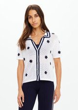 THE UPSIDE women's white organic cotton Piazza Koa Knit Shirt features a ribbed white collar with navy striped placket edge and pearlised shell button closure. Made for everyday.