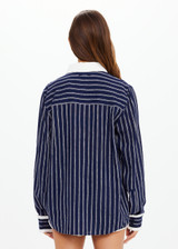 THE UPSIDE women's navy & white stripe Belize Bobbi Collared Shirt features a ruffled detail and sleeve cuff with button closure in linen fabrication. Made for lifestyle.