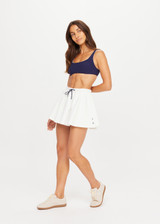THE UPSIDE women's white tennis, pickleball & padel Daria Skort is made from organic cotton and features an internal short with elasticated waistband and drawcord.