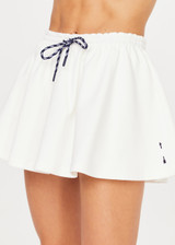 THE UPSIDE women's white tennis, pickleball & padel Daria Skort is made from organic cotton and features an internal short with elasticated waistband and drawcord.