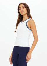THE UPSIDE women's white performance Kirsty Rib Tank Top is designed to be fitted and features a striped navy and white rib neckband and armhole.