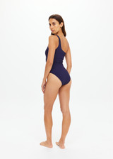 THE UPSIDE women's navy Mystery One Shoulder One Piece features a shelf bra with boning and removable cups. Designed for swim.