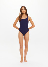 THE UPSIDE women's navy Mystery One Shoulder One Piece features a shelf bra with boning and removable cups. Designed for swim.