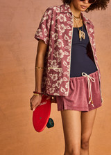 THE UPSIDE women's floral organic cotton Lahaina Cabana Zip Shirt features front patch pockets with zipers. Made for lifestyle.