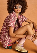 THE UPSIDE women's floral organic cotton Lahaina Cabana Zip Shirt features front patch pockets with zipers. Made for lifestyle.