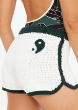 THE UPSIDE women's cream Molokai Lee Crochet Short is fitted with a contrast green elastic waistband and hem, featuring green and cream Yin Yang patch at back. Made for lifestyle.