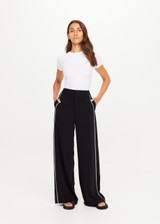 THE UPSIDE women's black Haveli Wide Leg Pant is true to size with a structured waistband, fly zipper, belt loops, and cream embroidered side seams. Made for lifestyle.