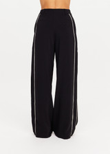 THE UPSIDE women's black Haveli Wide Leg Pant is true to size with a structured waistband, fly zipper, belt loops, and cream embroidered side seams. Made for lifestyle.