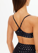 THE UPSIDE women's black Moonstone Zoe Bra offers a soft, supportive fit with a scooped low neckline, T-bar back, and adjustable elastic straps. Made for yoga & pilates.