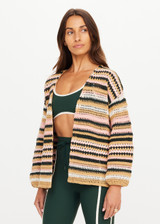 THE UPSIDE women's stripe Bohemia Mari Crochet Jacket offers a relaxed fit with elasticated cuffs and striped design in pink, green, cream, and tan. Made for lifestyle.