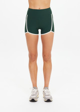 THE UPSIDE women's green Santa Fe 3.5inch Spin Short is soft, supportive with cream side seam and hem bindings, and side pockets. Made for yoga & pilates.