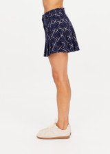 THE UPSIDE women's check Valencia Jones Pleated Skirt is true to size with structured waistband, belt loops, and antique brass button closure at centre front. Made for lifestyle.