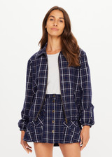 THE UPSIDE women's check Valencia Lexi Collared Jacket is relaxed fit with zip-through bomber style, collar, and front flap pockets with antique brass buttons. Made for lifestyle.
