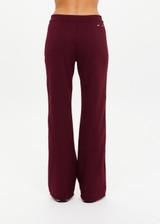 THE UPSIDE women's maroon Mendoza Jackie Flare Pant is true to size and features cream piping along side seams and zipper pockets. Made for lifestyle.