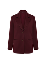 THE UPSIDE women's maroon Mendoza Boyfriend Blazer is designed as a boyfriend style single breasted blazer with cream piping along side seams, tortoiseshell buttons and front welt pockets.