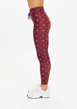 THE UPSIDE women's maroon recycled Bandhani 25-inch midi pant has a soft, supportive fit with elastic drawcord, cream aglets, and mid-rise. Made for yoga and Pilates.