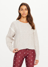 THE UPSIDE women's natural wool blend Xanthe Crew Neck Knit Sweater has a relaxed fit with cable knit and decorative blanket stitching. Made for lifestyle.