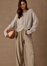 THE UPSIDE women's natural wool blend Xanthe Crew Neck Knit Sweater has a relaxed fit with cable knit and decorative blanket stitching. Made for lifestyle.