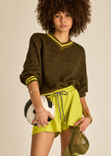 THE UPSIDE women's olive organic cotton Castilla Clementine Knit Crew is designed for a relaxed fit and features a high V neckline with lime-striped rib. Made for lifestyle.