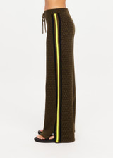 THE UPSIDE women's olive organic cotton Castilla Juniper Knit Pant has a soft and supportive fit and features a straight leg with contrast side stripes. Made for lifestyle.