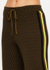 THE UPSIDE women's olive organic cotton Castilla Juniper Knit Pant has a soft and supportive fit and features a straight leg with contrast side stripes. Made for lifestyle.