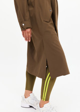 THE UPSIDE women's green James hooded trench coat features recycled waterproof polyester, a true-to-size fit and adjustable waist belt. Made for lifestyle.