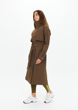 THE UPSIDE women's green James hooded trench coat features recycled waterproof polyester, a true-to-size fit and adjustable waist belt. Made for lifestyle.