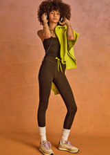 THE UPSIDE women's olive jacquard Castilla 25 Inch Midi Pant is designed for a soft and comfortable fit and features mid-rise with lime elastic drawcord. Made for yoga and pilates.