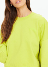 THE UPSIDE women's green organic cotton Paloma Crew is designed for a boxy fit and features a drop shoulder with ribbed neckline, cuffs, and hem. Made for lifestyle.
