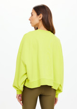 THE UPSIDE women's green organic cotton Paloma Crew is designed for a boxy fit and features a drop shoulder with ribbed neckline, cuffs, and hem. Made for lifestyle.