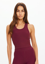THE UPSIDE women's maroon recycled peached Sophie Crop Top is designed for a soft and supportive fit and features a racerback longline bra with internal shelf bra. Made for yoga and pilates.