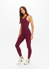 THE UPSIDE women's maroon recycled peached 25 Inch Legging is designed for a soft and supportive fit and features a mid-rise and moisture-wicking. Made for yoga and pilates.
