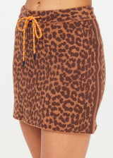 THE UPSIDE women's leopard organic cotton Malawi Karly Knit Mini Skirt offers a relaxed fit, featuring an elasticated waistband with orange drawcord and knitted stripes down sides. Made for lifestyle.