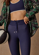 THE UPSIDE women's polka dot Spellbound 25inch Legging is supportive and comfortable with recycled rib fabric, elastic drawcord, and cream aglet ends. Made for yoga & pilates.