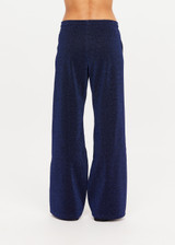 THE UPSIDE women's navy Galaxia Loretta Pant is designed for a mid to low rise fit and features elasticated waistband, drawcord with side seam pockets and knitted tape down sides. Made for lifestyle.