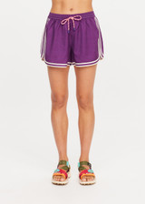 THE UPSIDE women's purple Klio Short is designed for a mid-rise, relaxed fit and features a soft elasticated waistband with drawcord and contrast binds in cream along curved hem. Made for everyday.