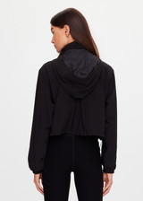THE UPSIDE women's black Ace Shell Jacket is a water-resistant cropped zip-through jacket and features front pockets and an adjustable drawcord at waist. Made for running.