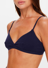 THE UPSIDE women's navy Palais Rib Capri Bra is designed to be worn under sheer garments and features a v neckline with adjustable straps in a soft ribbed fabrication. Made for lifestyle.
