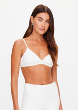 THE UPSIDE women's white Palais Rib Capri Bra is designed to be worn under sheer garments and features a v neckline with adjustable straps in a soft ribbed fabrication. Made for lifestyle.