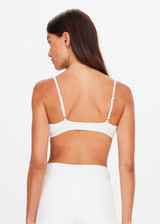 THE UPSIDE women's white Palais Rib Capri Bra is designed to be worn under sheer garments and features a v neckline with adjustable straps in a soft ribbed fabrication. Made for lifestyle.
