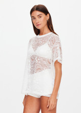 THE UPSIDE women's white Memento Lace Sammi Tee is designed to be sheer, oversized and can be paired with the Capri Bra for coverage. Made for lifestyle.