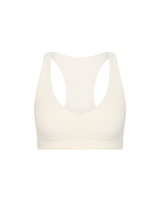 THE UPSIDE women's cream recycled soft peached Courtship Jetta Racerback Bra features a V neckline with removable cups and an elasticated underbust for support. Made for tennis, golf & pickleball.