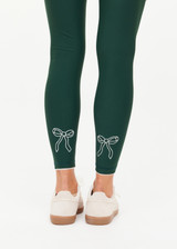 THE UPSIDE women's green recycled soft peached Racquet 25inch Pocket Legging is mid-rise and features side pockets, an elasticated drawcord and mini scallop lce detailing at cuffs. Made for tennis, golf & pickleball.