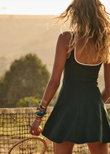 THE UPSIDE women's green recycled soft peached Racquet Maxine Mini Dress features a square neckline with contrast cream binds, an internal shelf bra and built-in shorts with pockets. Made for tennis, golf & pickleball.