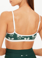 THE UPSIDE women's green Racquet Scoop Danni Bra features a contrast binded scoop neckline, adjustable straps and removable cups with a mini scallop trim at underbust. Made for tennis, golf & pickleball.