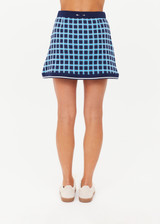 THE UPSIDE women's navy and blue plaid cotton Clubhouse Reece Mini Skirt is designed as a faux wrap skirt featuring a soft elastic waistband and a curved hemline. Made for tennis, golf & pickleball.