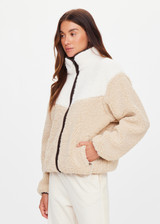 THE UPSIDE women's natural Harlow Fleece Zip Through is designed for a relaxed fit in a warm fleece fabrication and features an elastic waist and cuffs and zip pockets. Made for lifestyle.