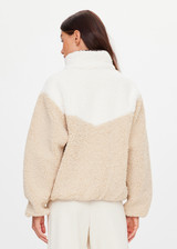 THE UPSIDE women's natural Harlow Fleece Zip Through is designed for a relaxed fit in a warm fleece fabrication and features an elastic waist and cuffs and zip pockets. Made for lifestyle.